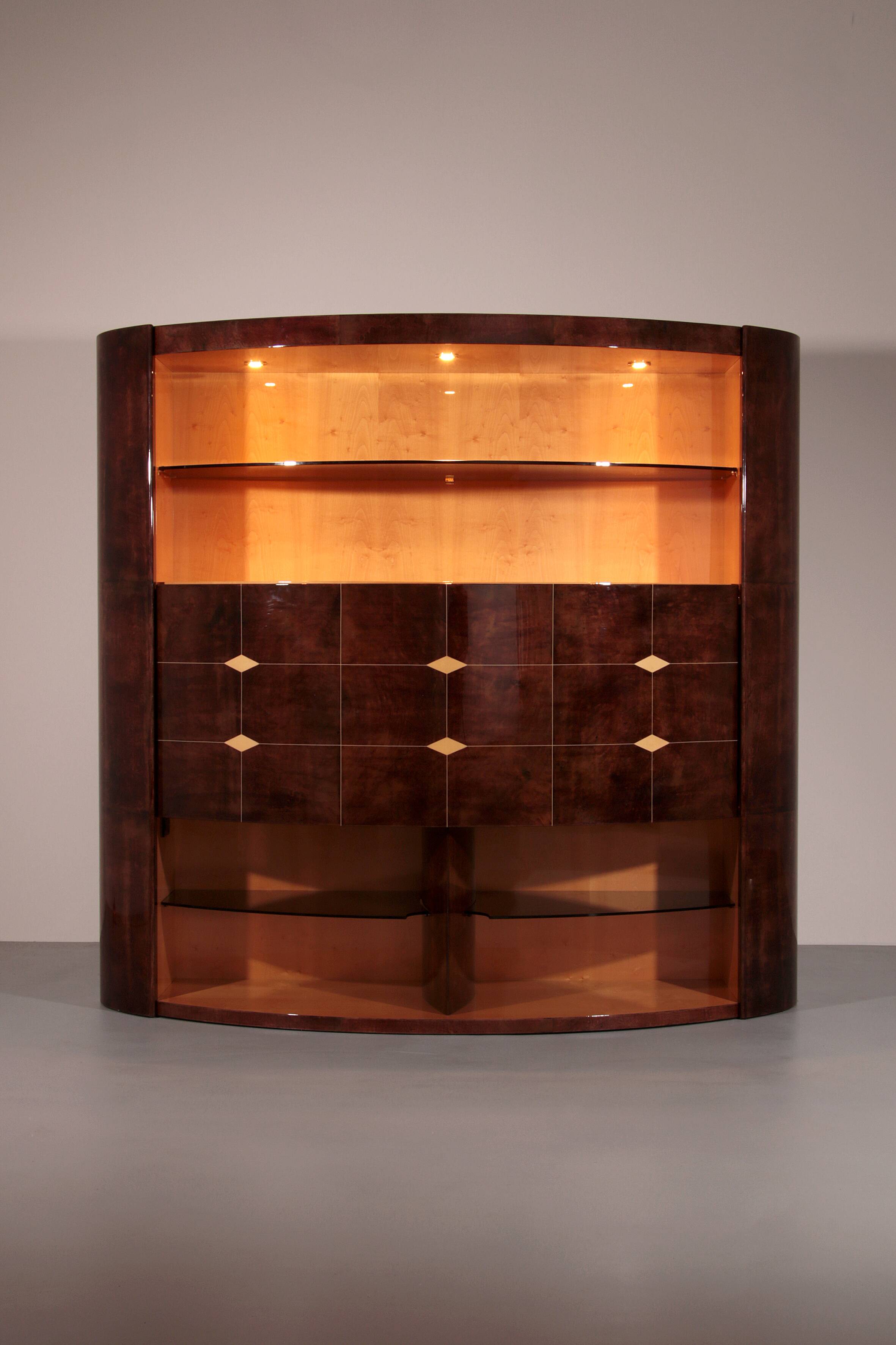 Iconic Aldo Tura brown goatskin bar cabinet with electric lift & mirror interior.