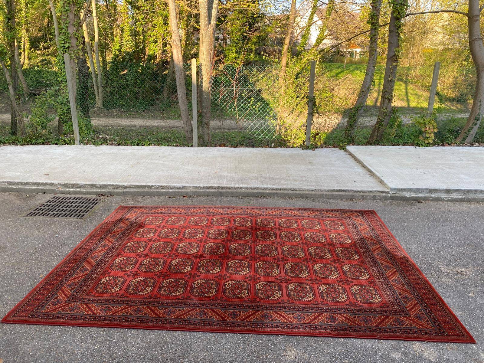 Tapis persan en laine rouge bordeaux Louis de Poortere 250x350cm