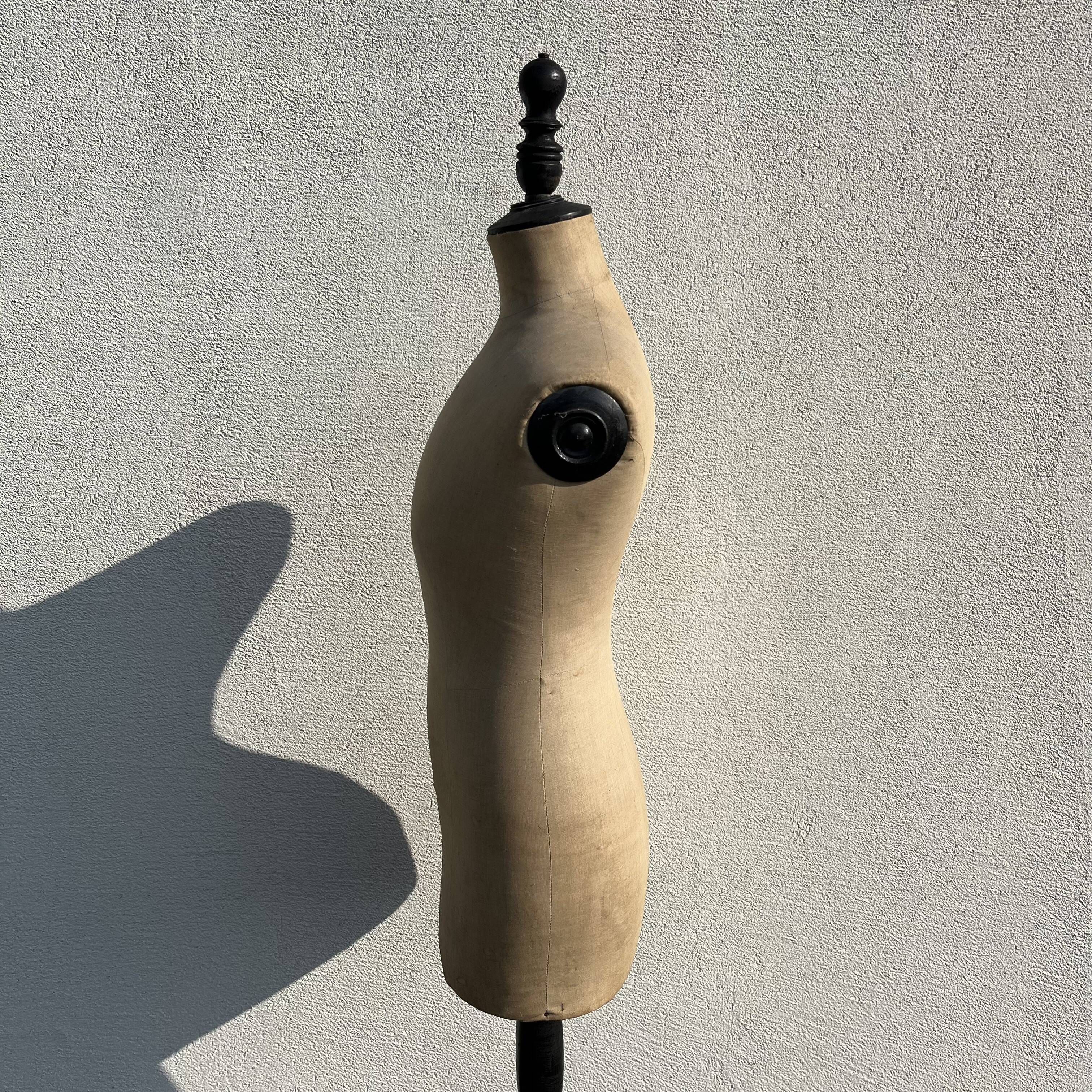 Antique mannequin in fabric and blackened wooden foot Stockman Paris Le Louvre