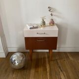 Wooden bedside table and nude