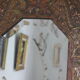 Antique bevelled artisanal mirror in repoussé copper - 54x45cm