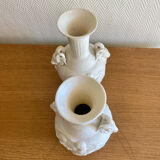 Paire de vases en biscuit decor putti et tête de bélier