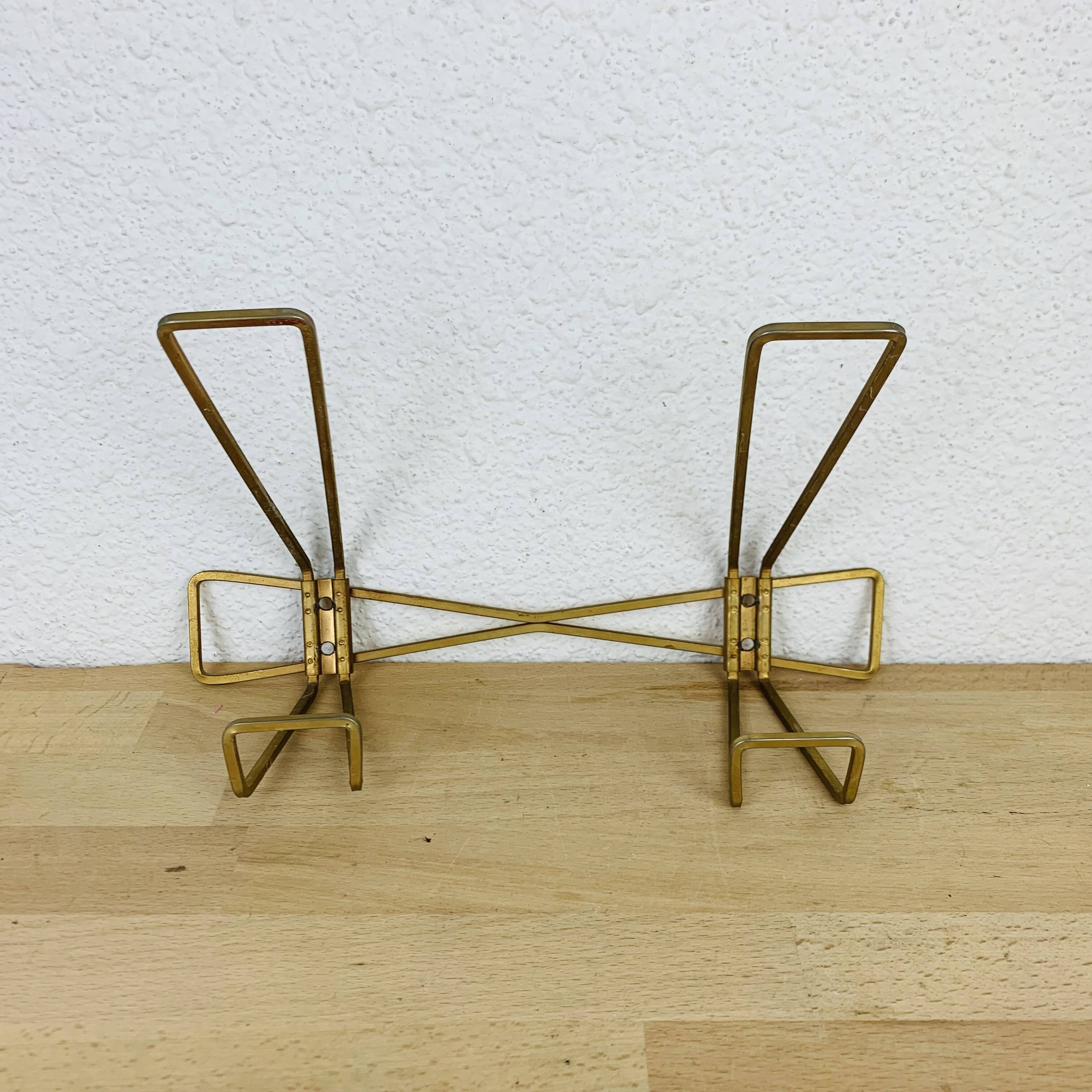 Wall coat rack with golden metal hook from the 1950s