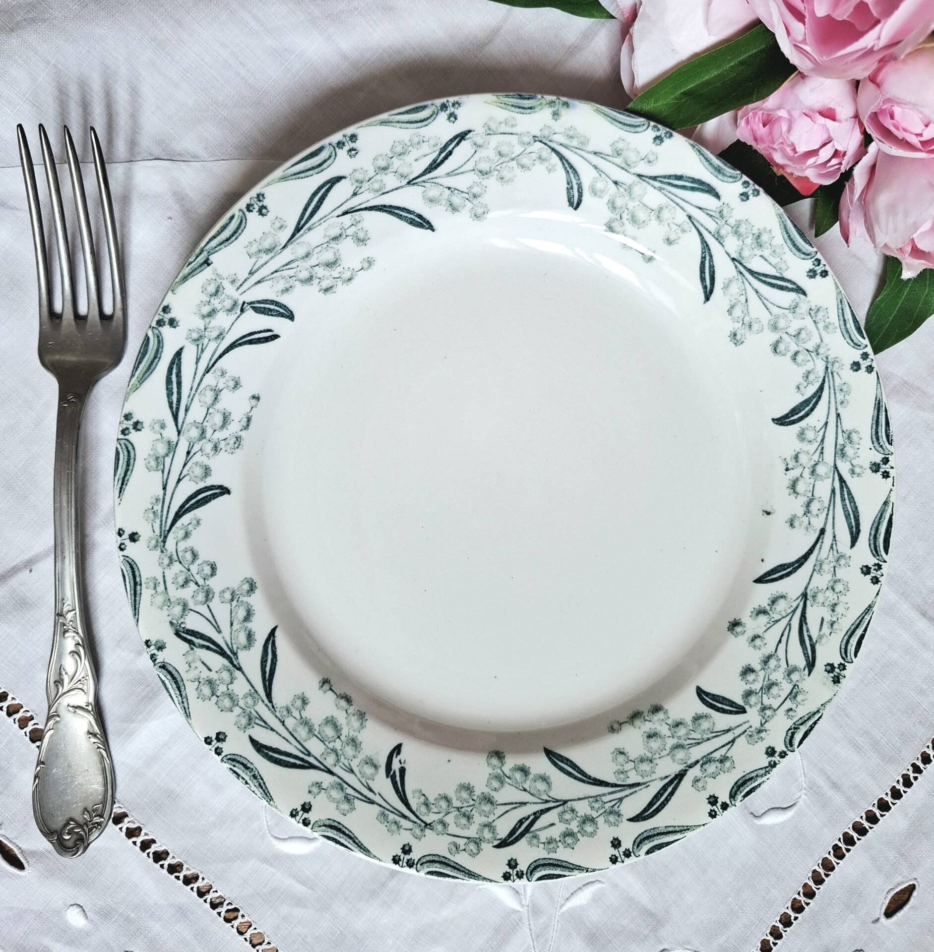 Old mismatched flat plates made of ironstone earthenware.