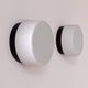 Pair of vintage wall lights in black Bakelite and frosted opal glass, France 1970.