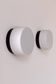 Pair of vintage wall lights in black Bakelite and frosted opal glass, France 1970.