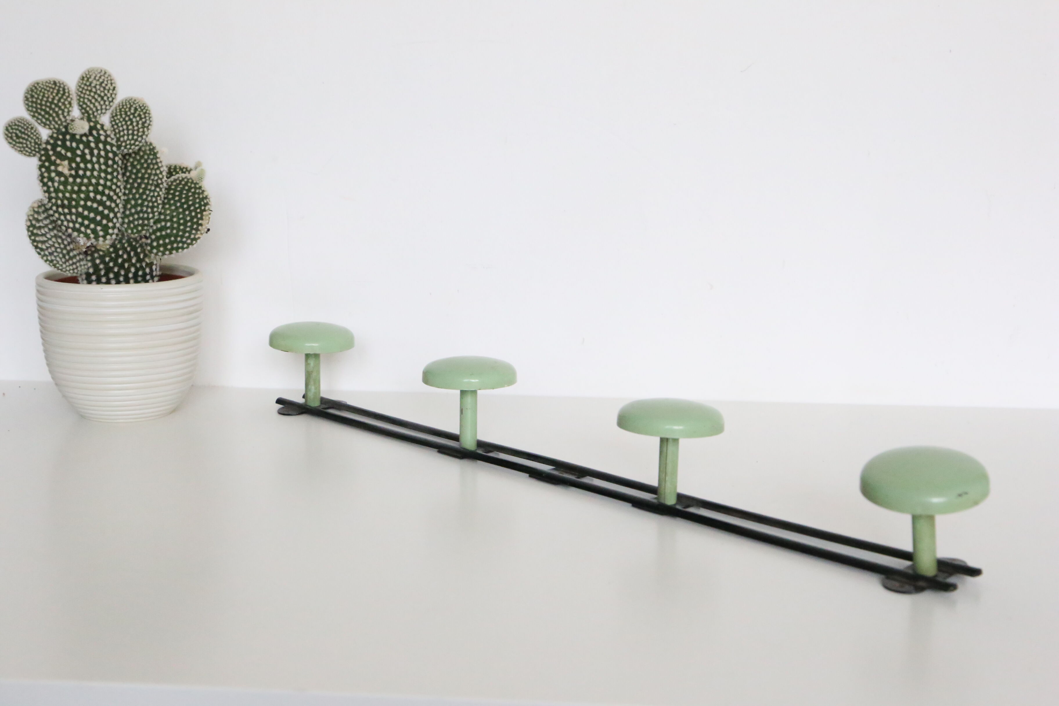 Metal, green and black, vintage wall coat holder