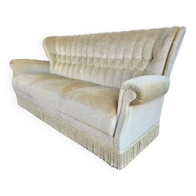 Canapé beige vintage avec franges