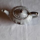 Musical teapot in white porcelain with floral decoration