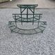 Old half-moon wrought iron plant holder