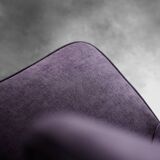 High-backed wing chair in oak and purple fabric, vintage Scandinavian style from the 1950s.