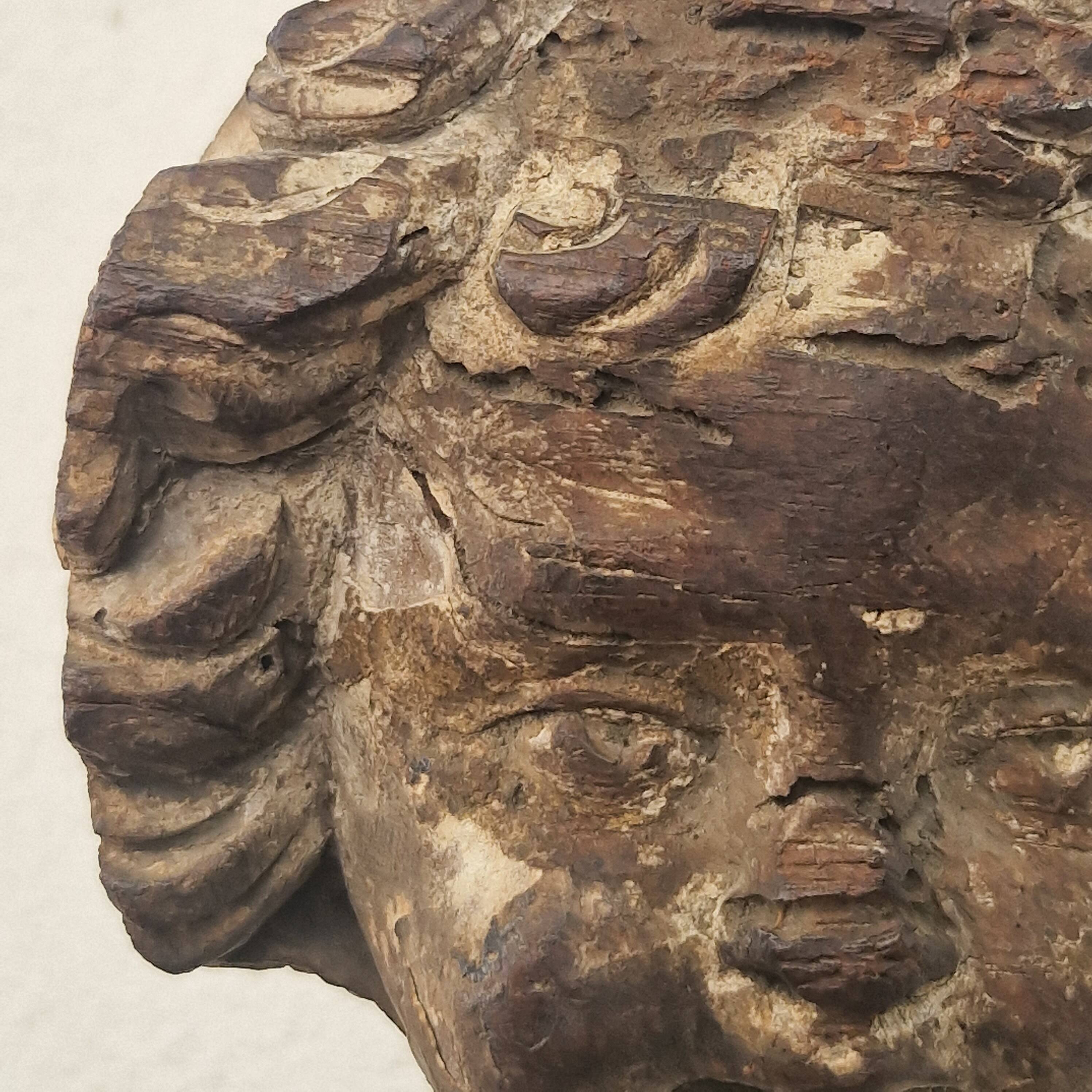 Sculpture. Ancient wooden angel head.
