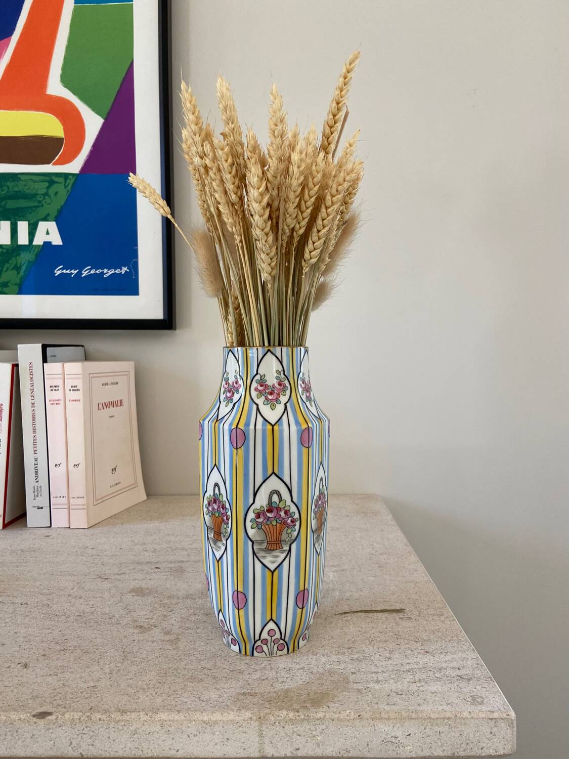 Striped ceramic vase with flowers
