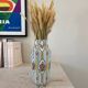 Vase en céramique à rayures fleuri