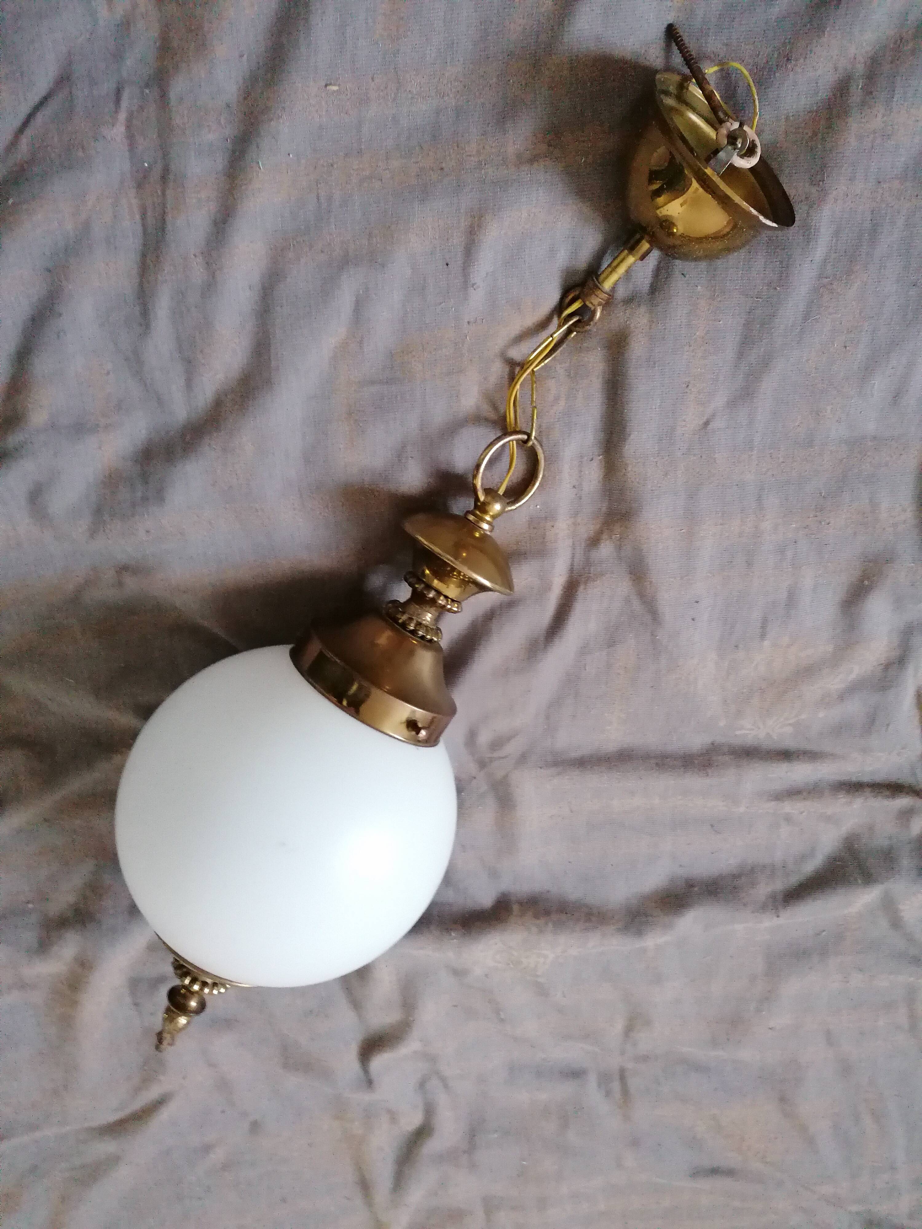 Golden metal and opaline glass globe