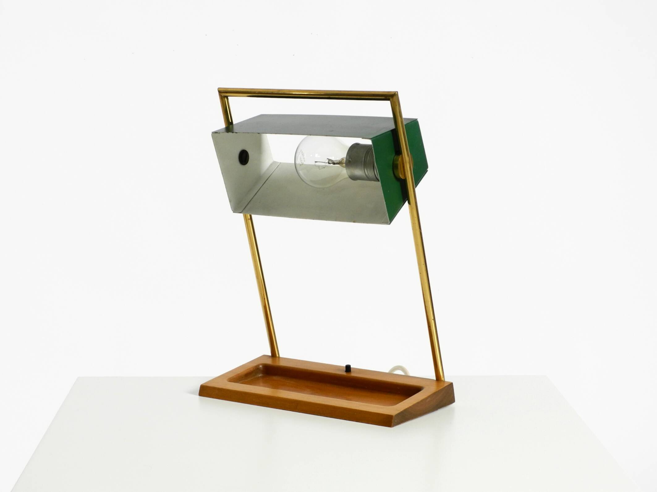 1960s Temde table lamp with a brass frame, teak base, and green lampshade