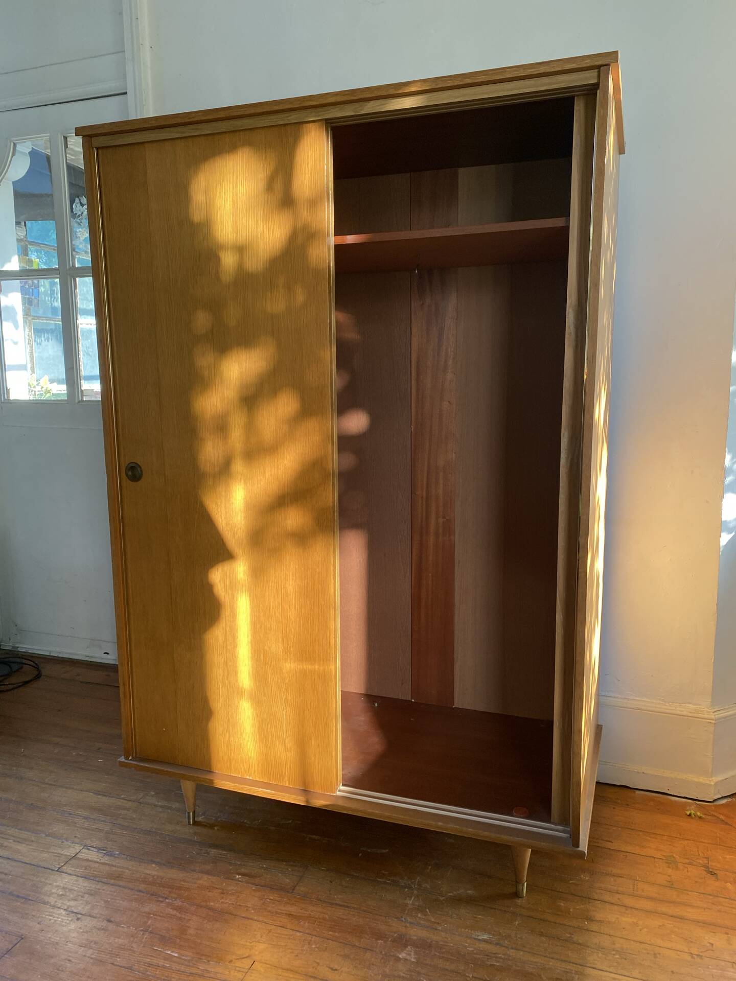 Large vintage Scandinavian wardrobe with two sliding doors.