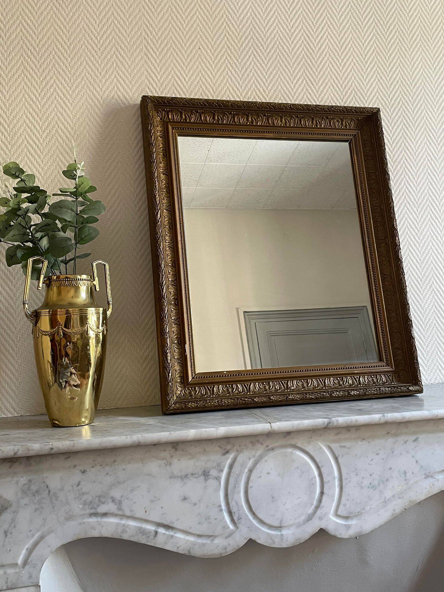Old mirror with golden wooden frame
