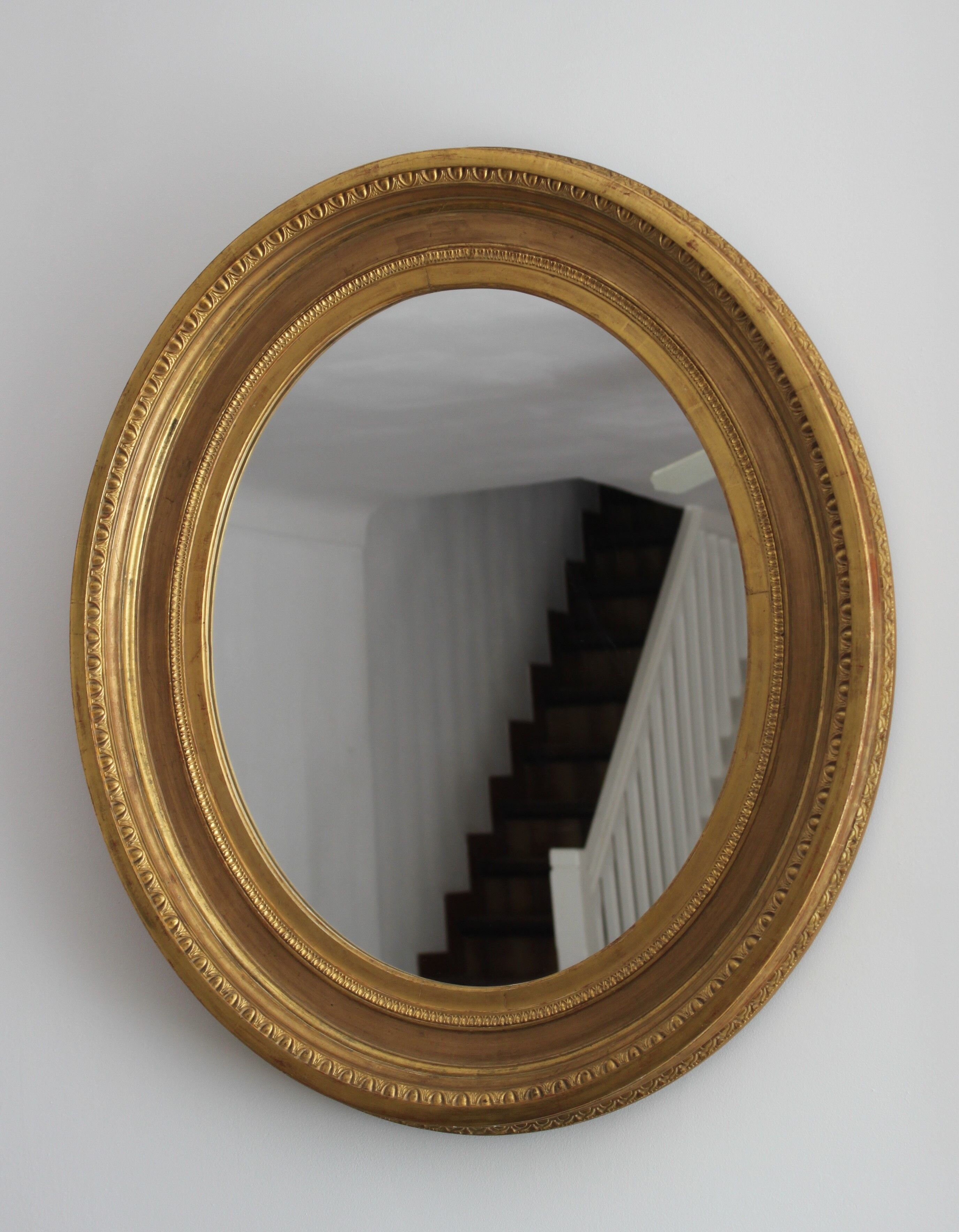 Mirror antique medallion gilded with gold leaf