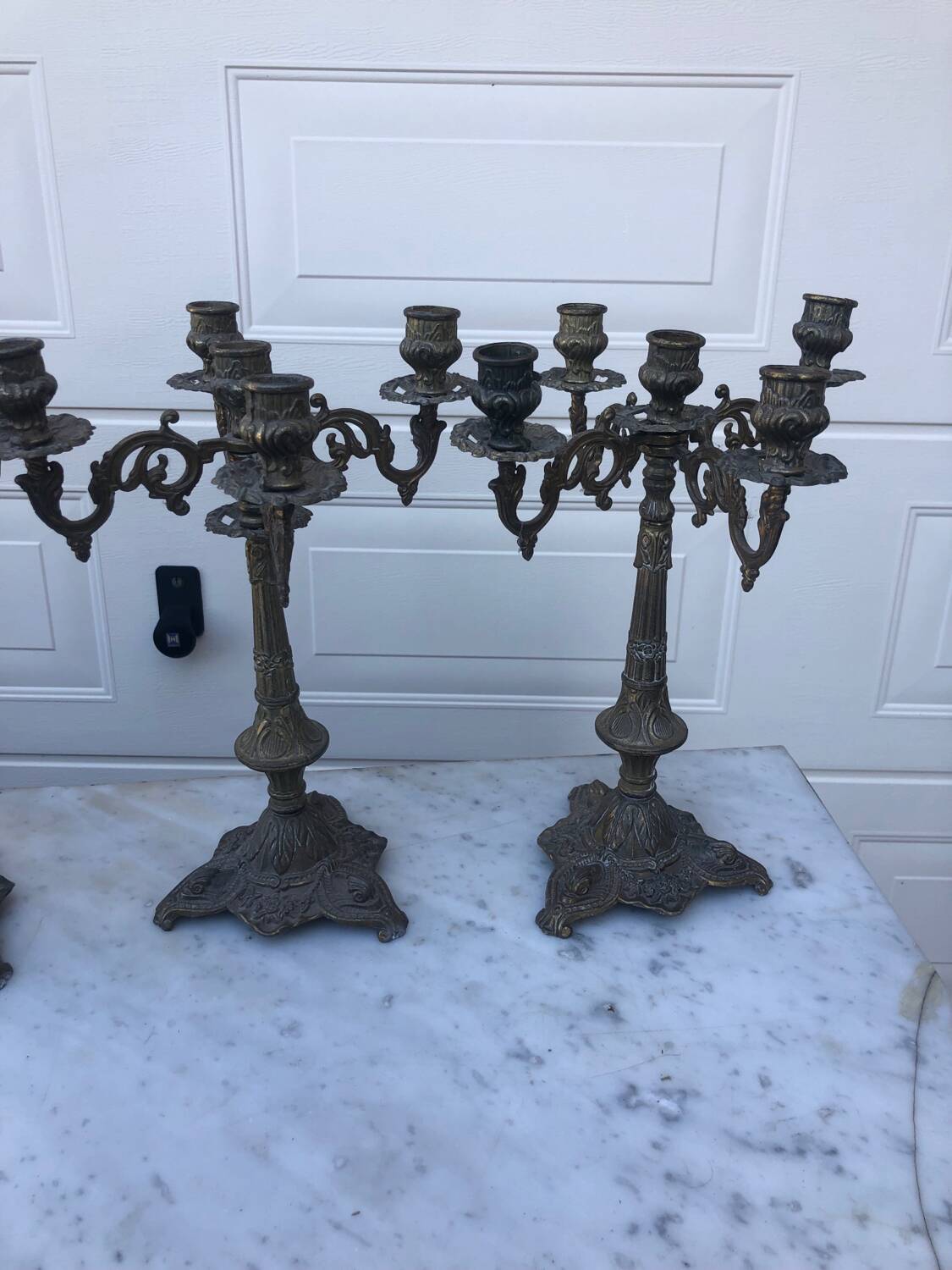 4 identical old brass candlesticks
