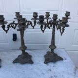 4 identical old brass candlesticks