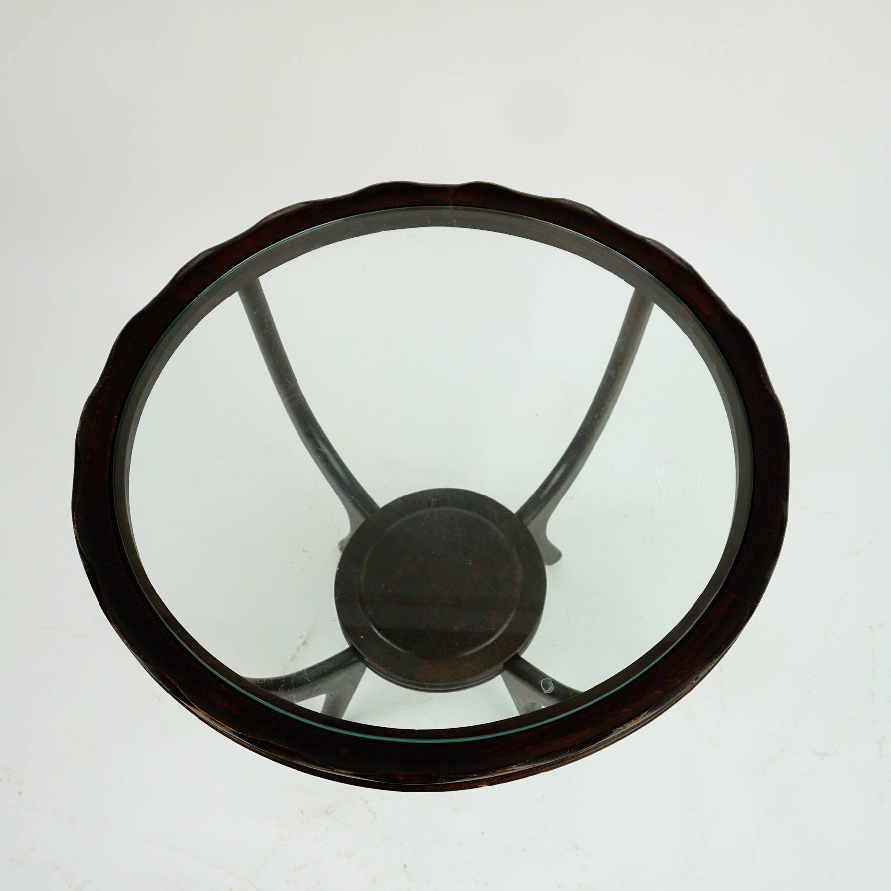 Italian round coffee table from the 1950s with a glass top, attributed to Carlo di Carli.