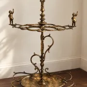Italian brass umbrella stand, Art Nouveau style, with putti.
