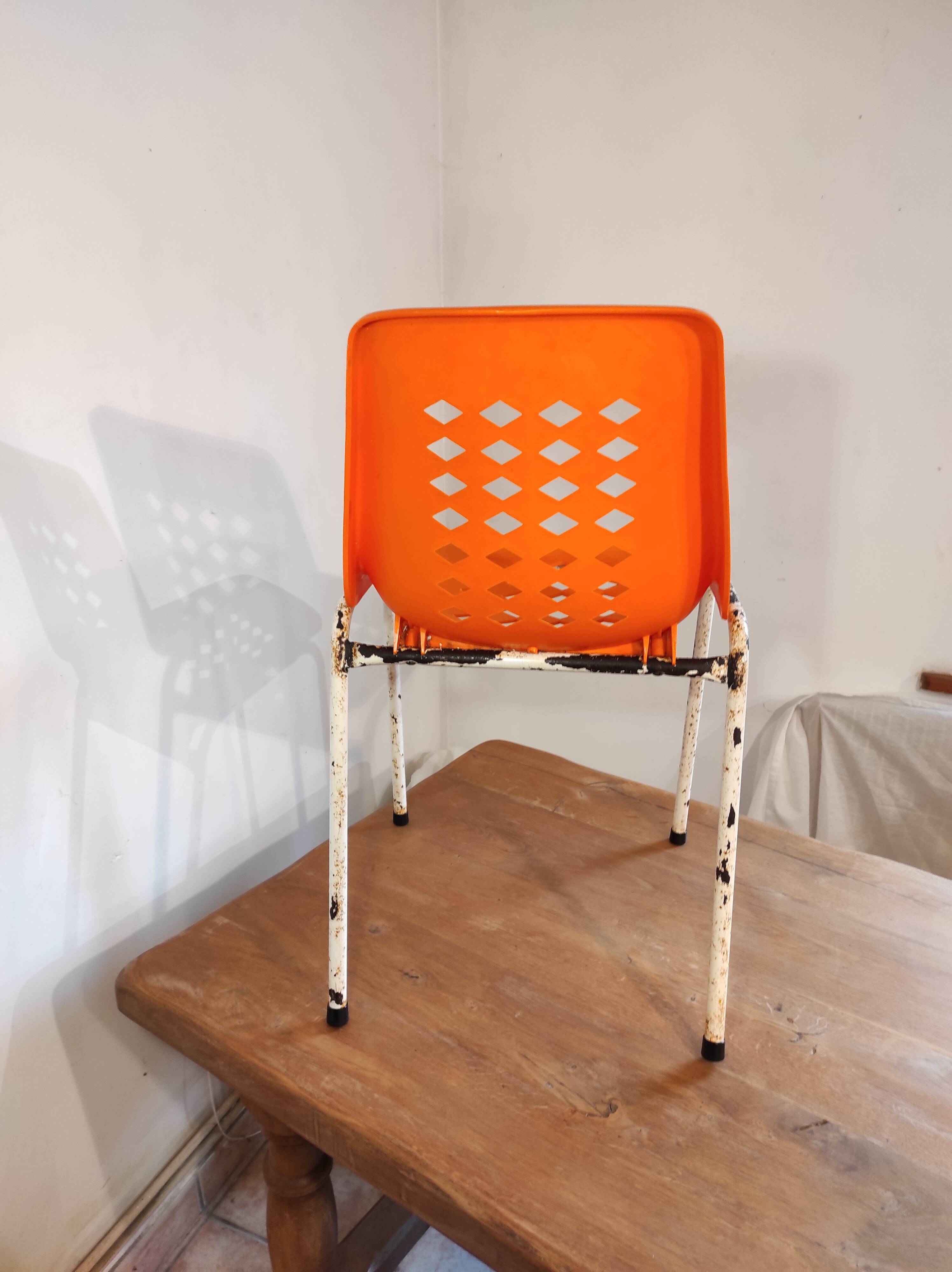 Chair with openwork plastic shell 1970