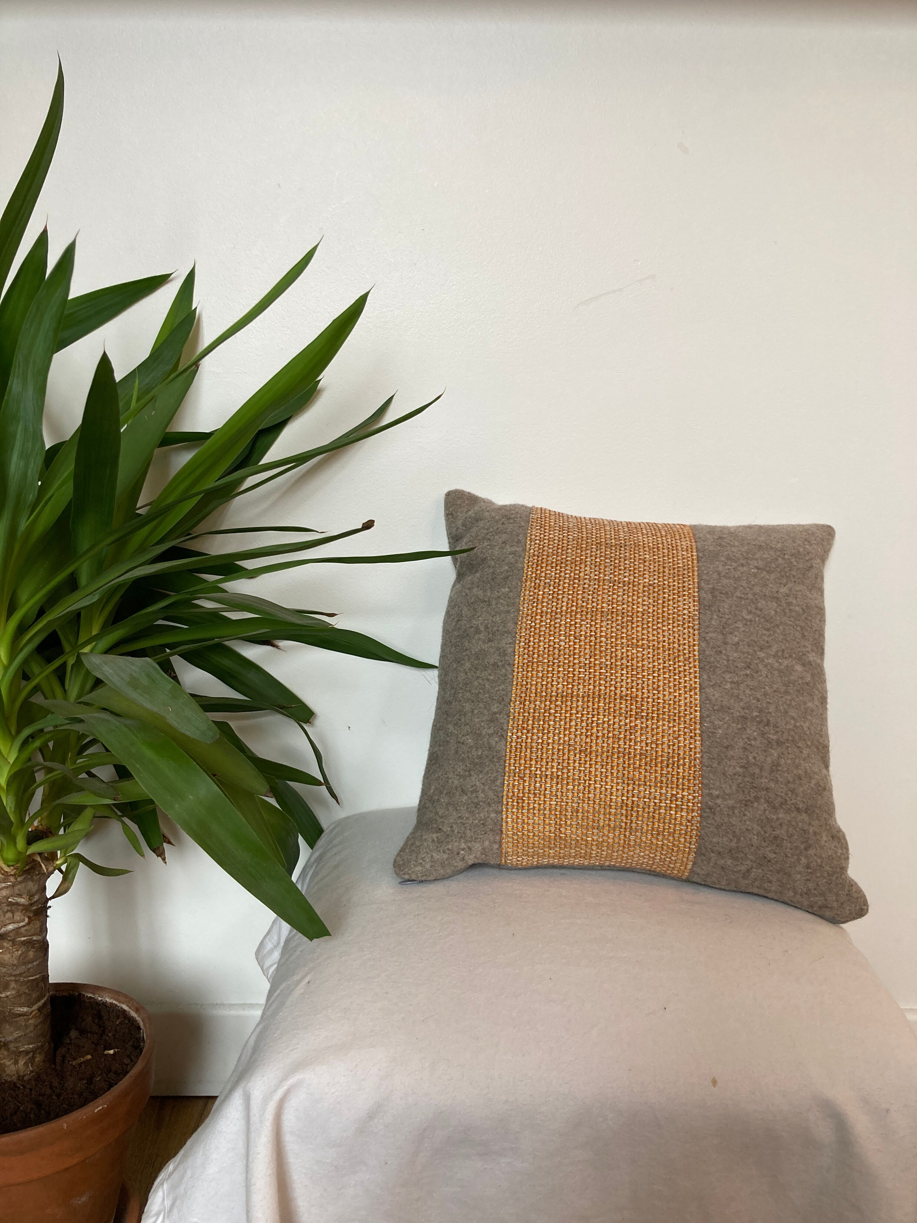 Bi-sided cushion gray wool yoke orange fabric