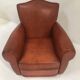 Large club chair in cognac leather