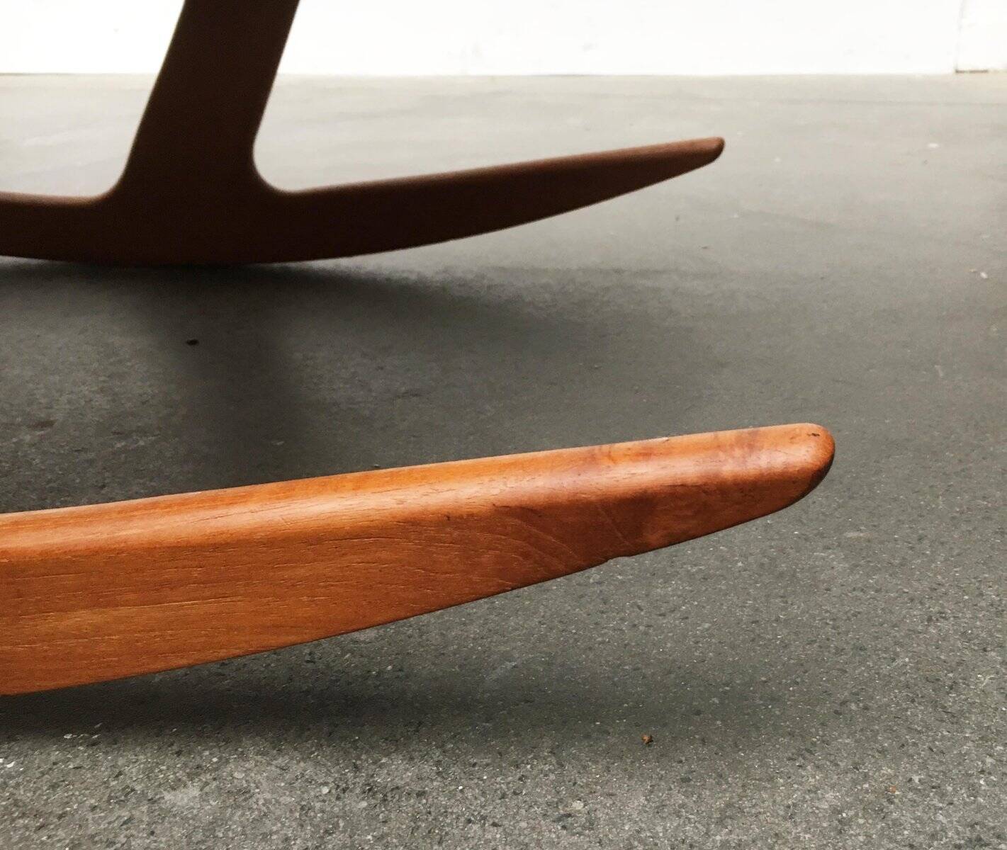 Mid-century model 100 rocking chair in Danish teak by Søren Georg Jensen for Kubus Møbler, 1960s.