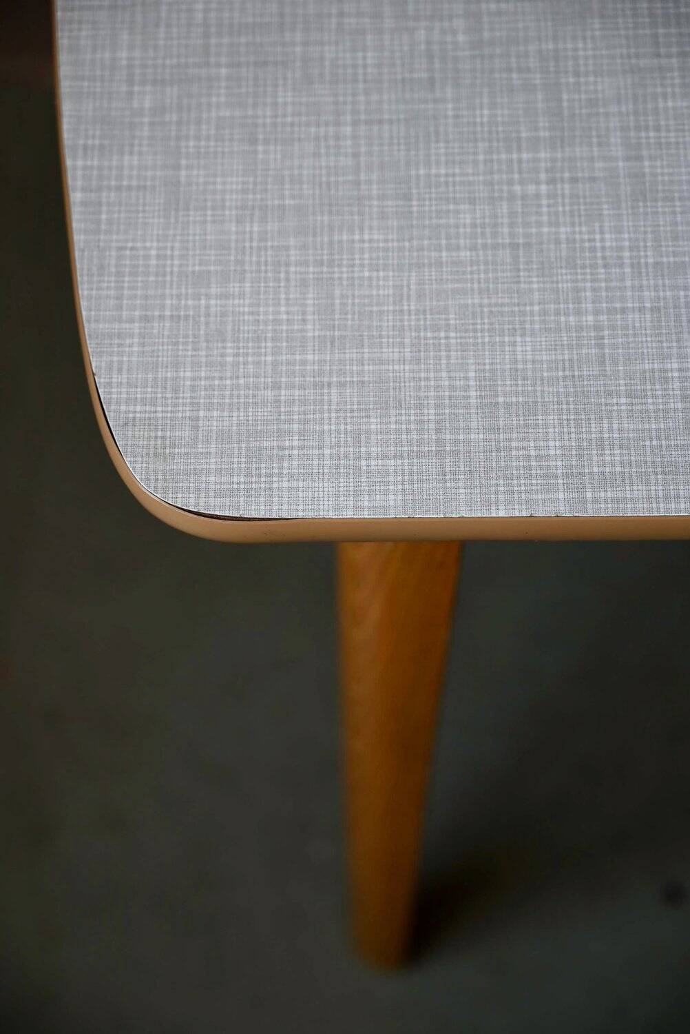 1950s Formica kitchen table with tapered legs and vintage drawer.