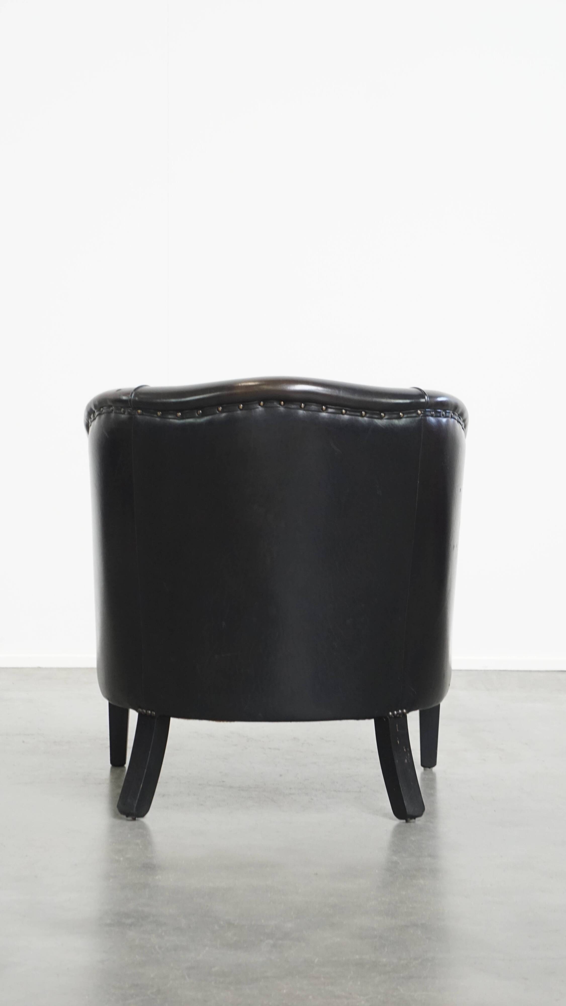 Fauteuil club noir/gris en cuir de mouton