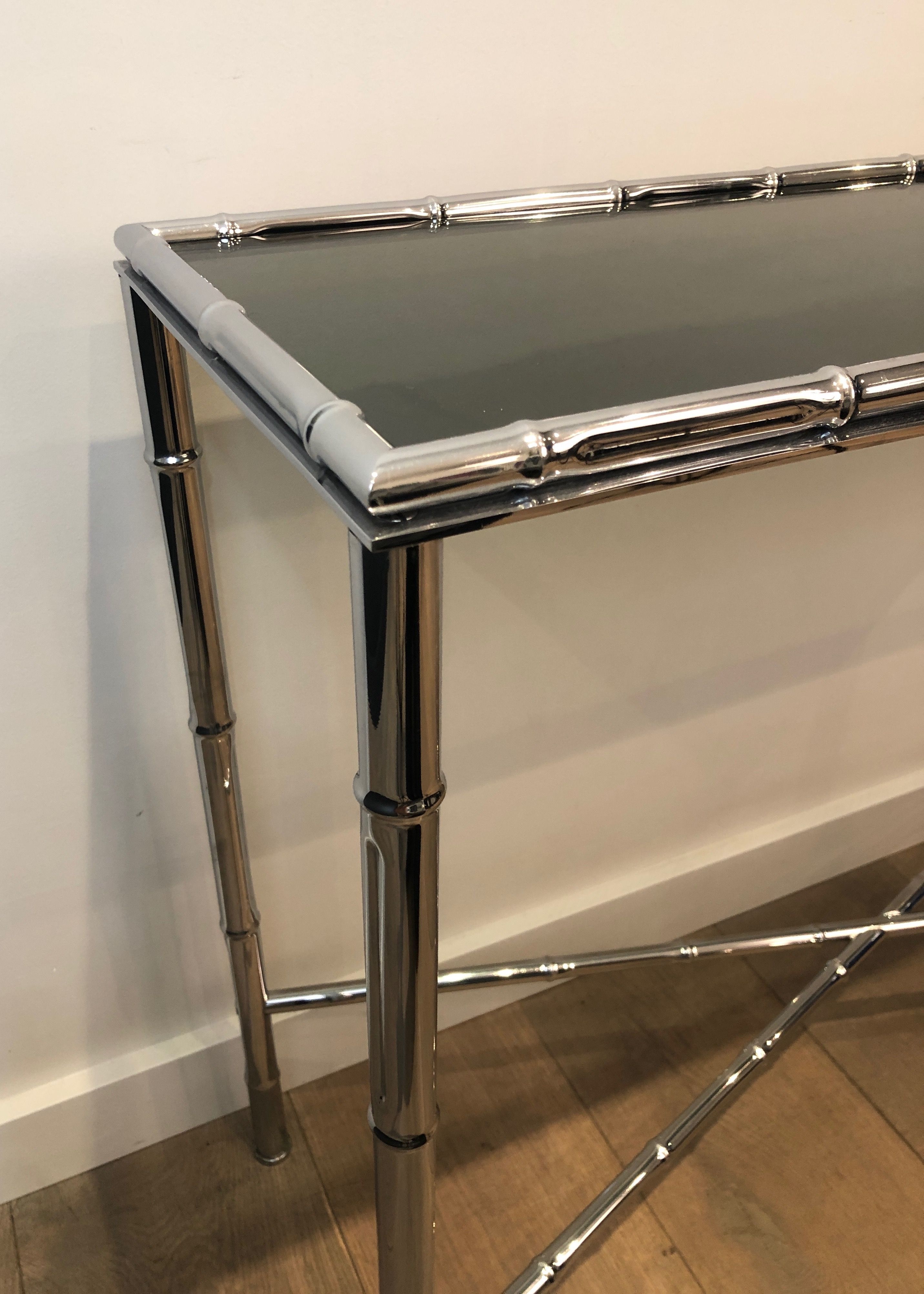 Console and chrome faux-bamboo mirror
