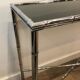 Console and chrome faux-bamboo mirror