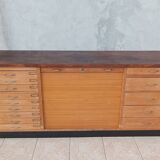 Workshop furniture with drawers and curtain in beech and walnut.