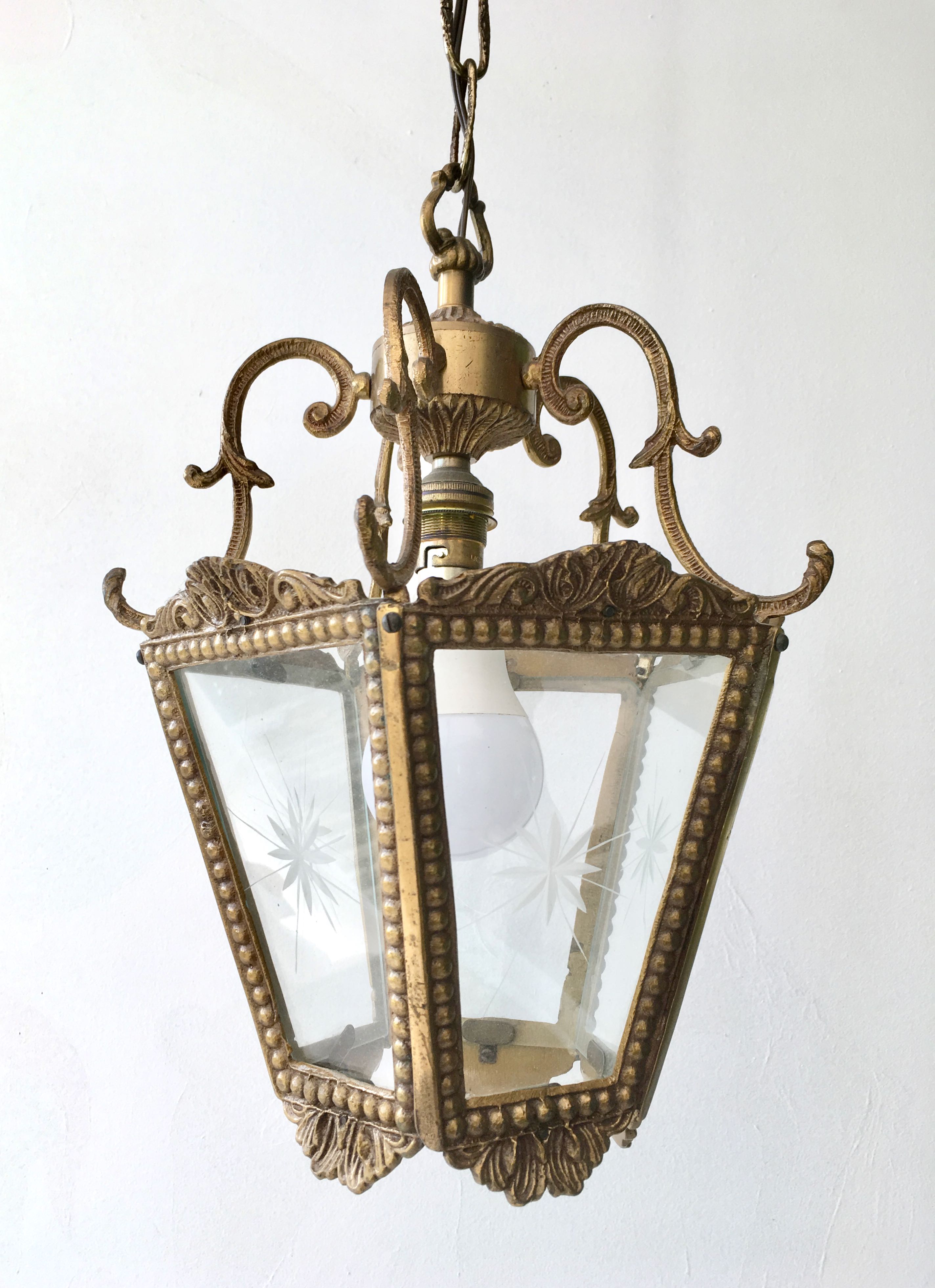 Hanging brass lantern and engraved glass