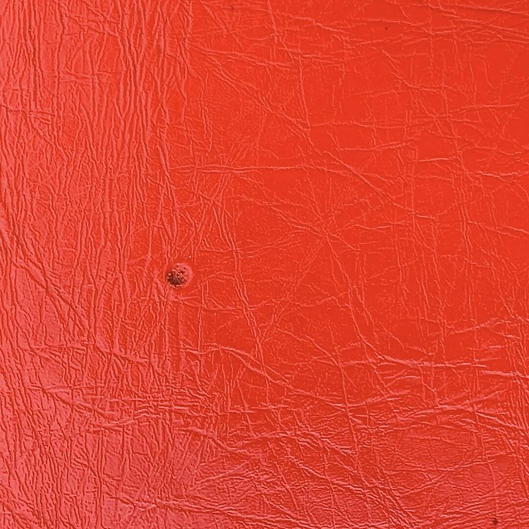 Large vintage pouf in red faux leather – diameter: 62 cm