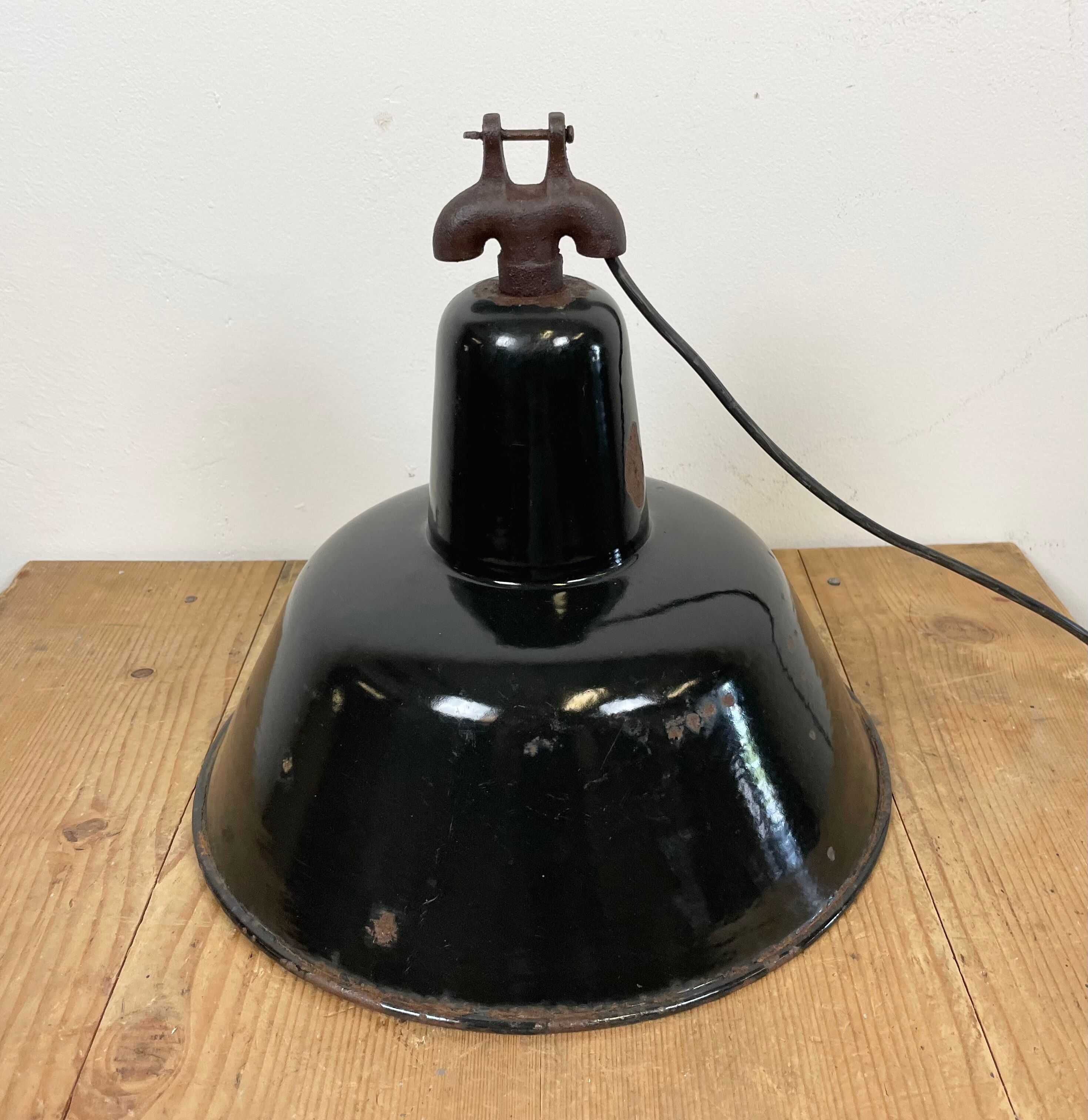 Industrial black enamel factory lamp with cast iron top, 1950s