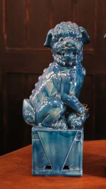 Pair of Foo dog bookends in turquoise glazed ceramic, Manises