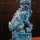 Pair of Foo dog bookends in turquoise glazed ceramic, Manises