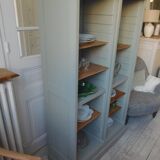 Vintage furniture transformed into a bookcase, verdigris patinated sideboard.