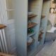 Vintage furniture transformed into a bookcase, verdigris patinated sideboard.