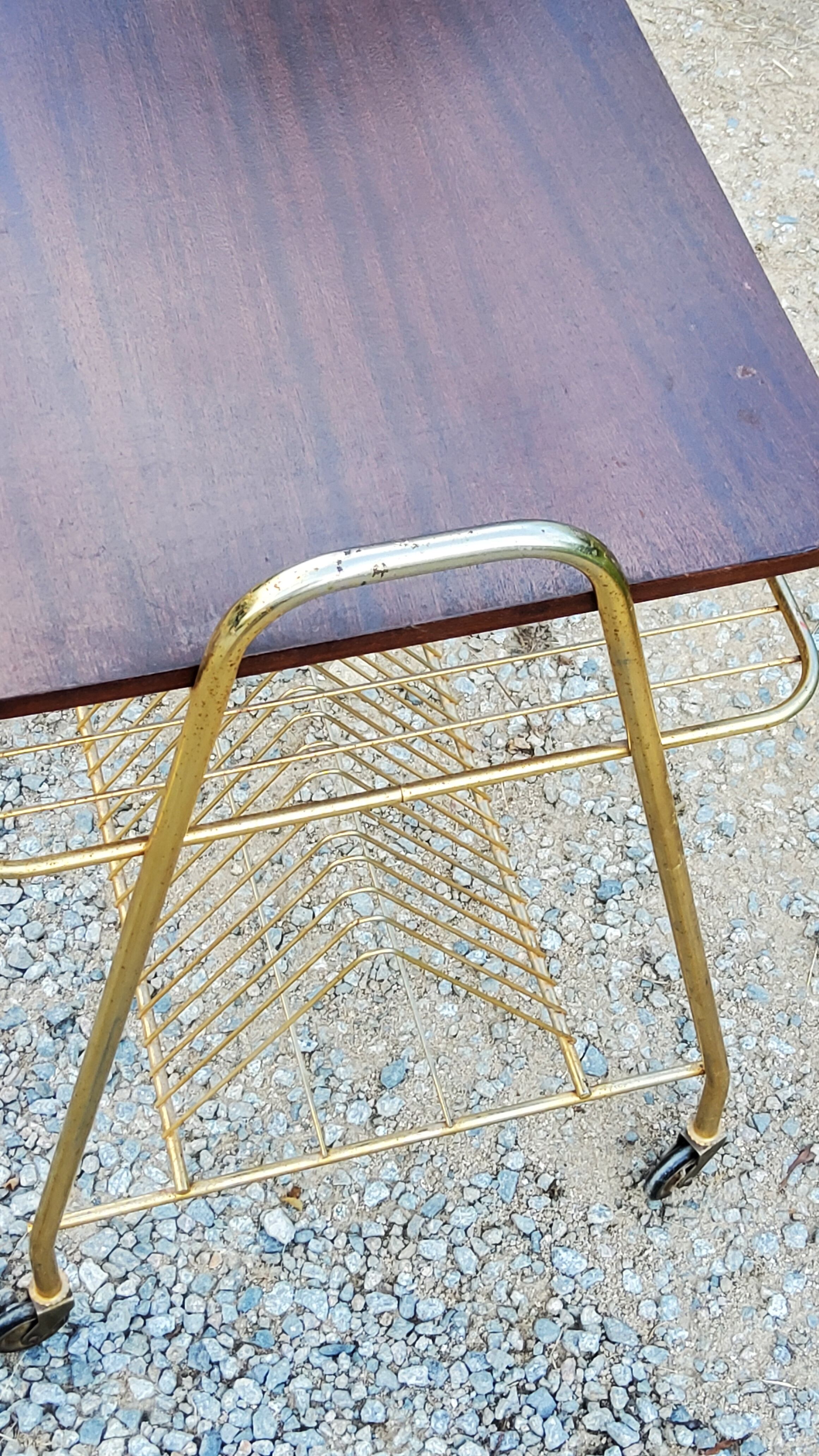 Side table of the 60s mahogany and gold metal range discs