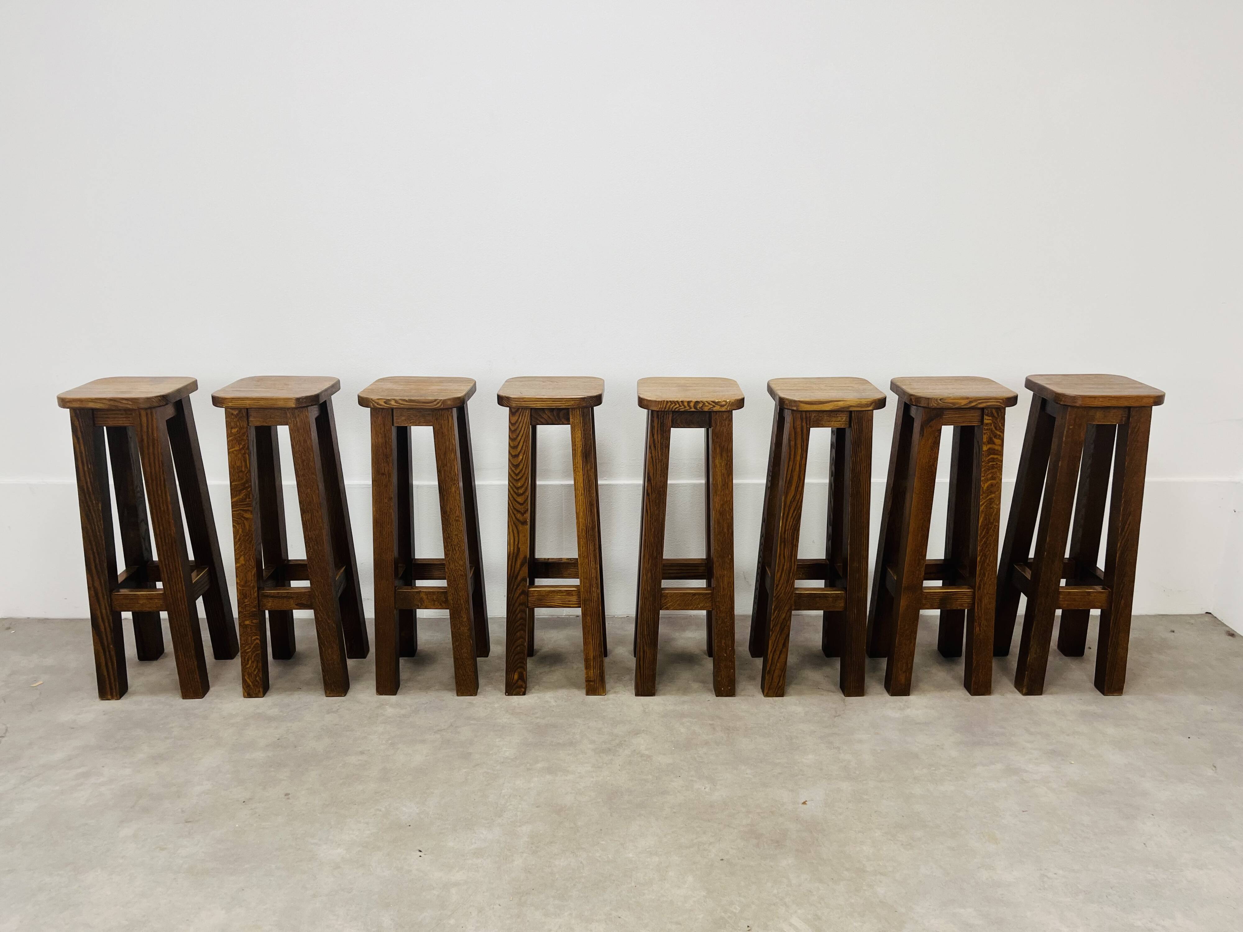 8 solid wood bar stools in brutalist style