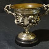 Carved silver bronze vase mounted on marble pedestal