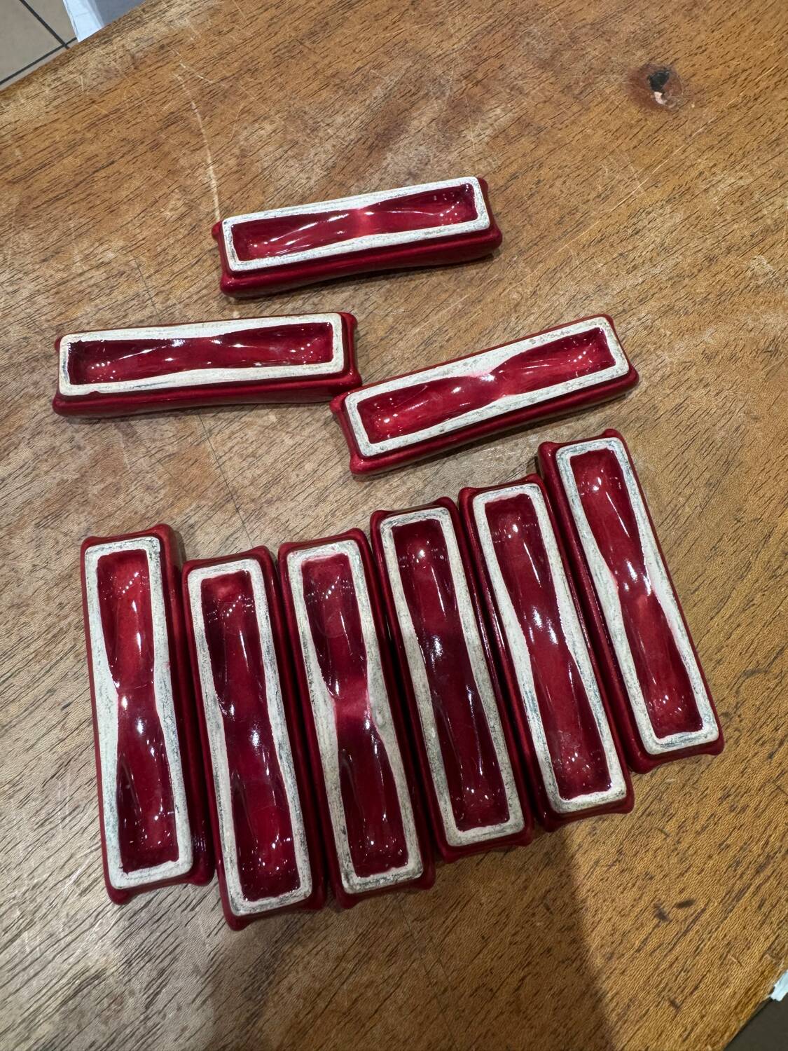 9 antique fish-shaped knife rests in majolica.