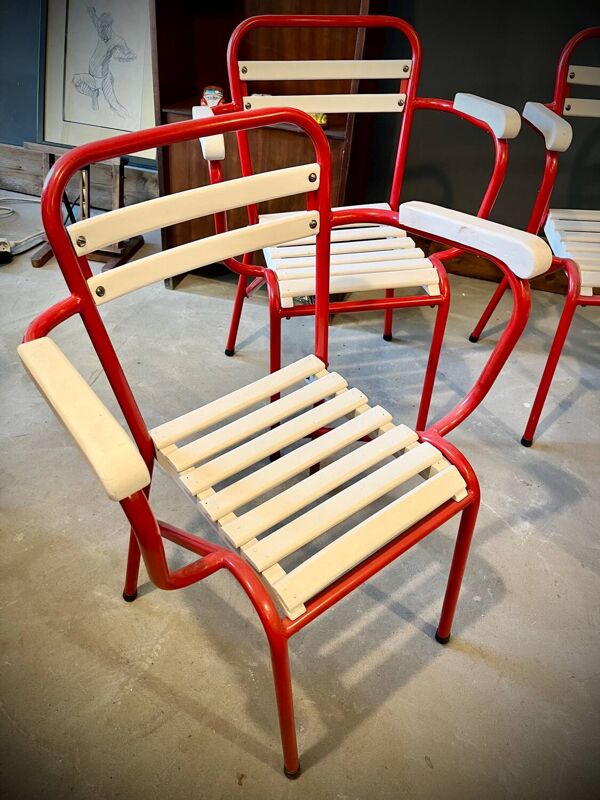Quatre chaises TOLIX avec accoudoirs