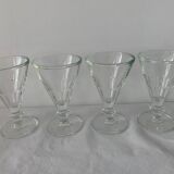 4 glasses of moulded pressed glass wine on foot