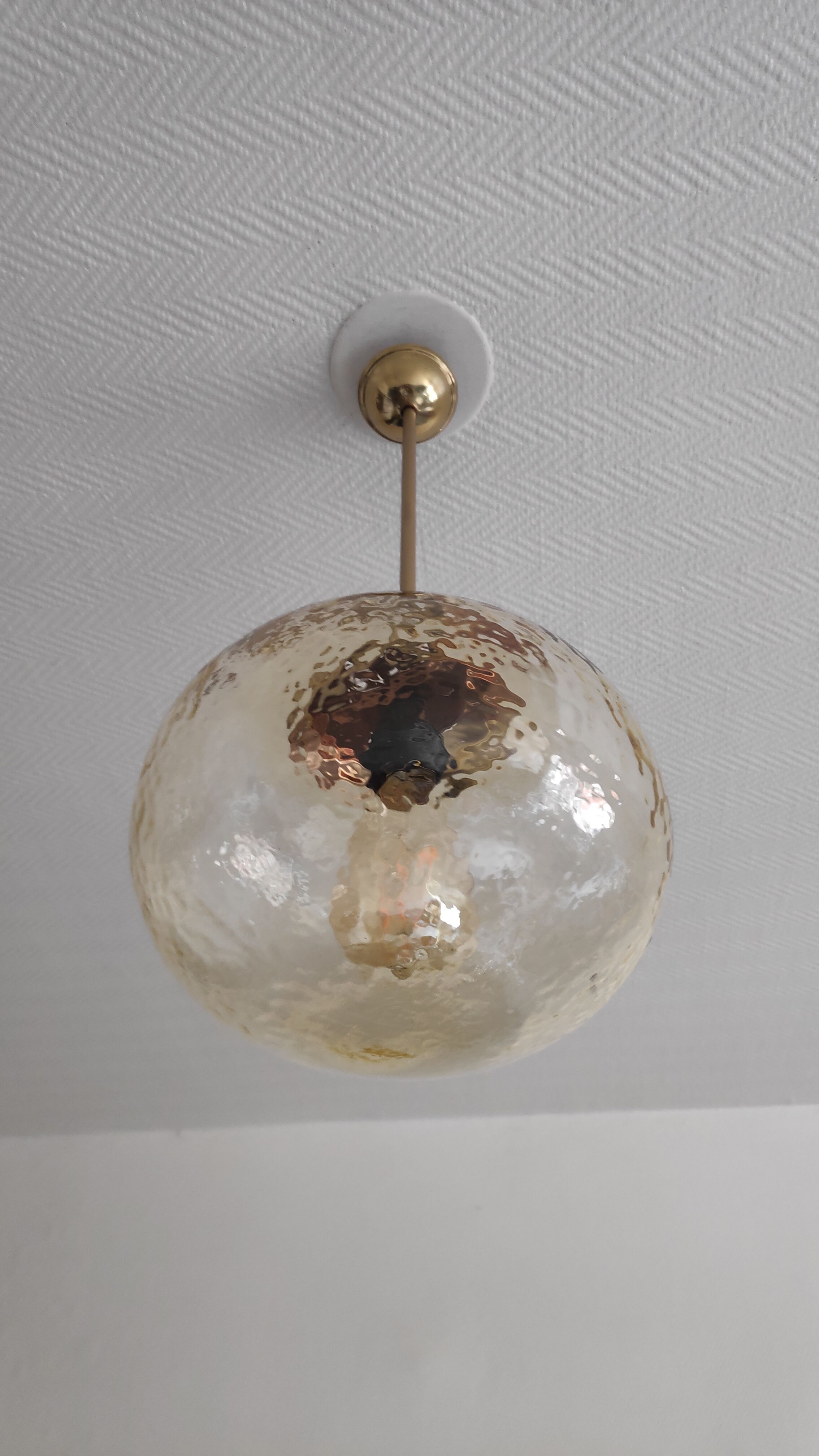 Vintage suspension globe in amber glass